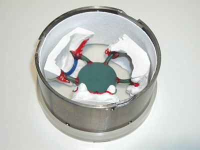 Wax modellations on modified refractory models in a large metal ring for Cast