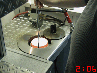 Loading the red hot mold in Cast is safe and easy with the special pliers